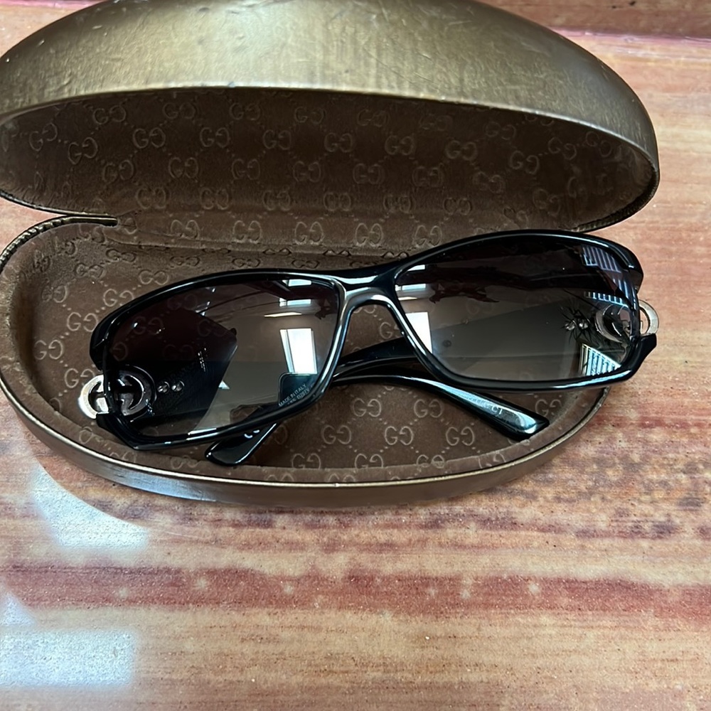 Gucci black sunglasses with stones.